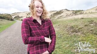 A happy blonde gets almost caught exposing herself on the beach