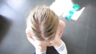 A girl is having fun with the guy in the gym, experiencing intense passion