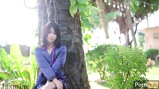A solo masturbation of an Asian girl in the garden, culminating in a wet pussy close-up