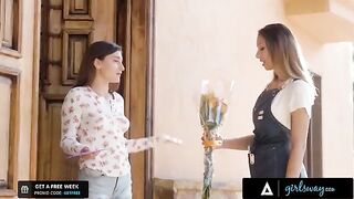 The girl is trying to reach a man, rubbing her pussy in flowers