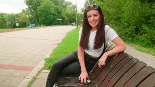 A couple is having fun outdoors and gets noticed by passers-by