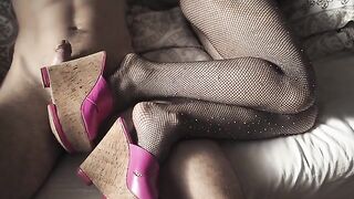 A sexy girl in high heels and pantyhose is always ready for a footjob