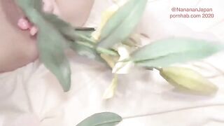 A cute girl in a floral dress has flowers in her ass