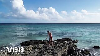 A sexy girl is naked on the beautiful beach