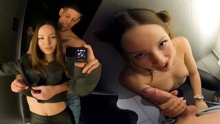 A couple is having a risk sex in the dressing room of the shopping mall