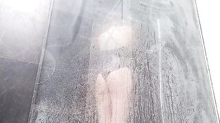 A hot woman squirts while rubbing her pussy in the shower