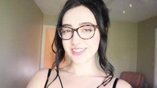 A cute girl is reading a funny book and trying not to cum