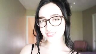 A cute girl is reading a funny book and trying not to cum