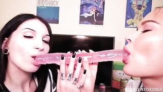 Two hot lesbians have their juicy pussies played with using a dildo