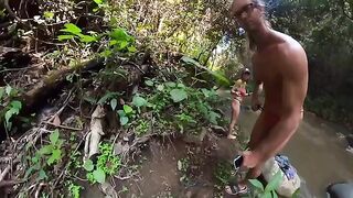 A couple is having fun in the jungle river, it's a very hot scene