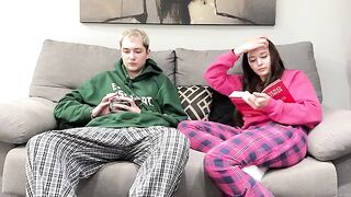Pervert stepbrother masturbating next to his stepsister on the couch