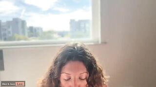 A cute woman demonstrates her sexual abilities by performing on her husband in the street