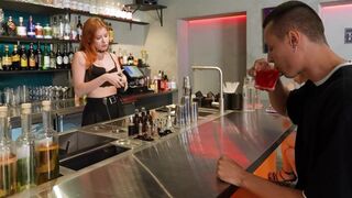 The hot bartender seduced a customer who was looking for something delicious