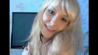 Blonde caresses her pussy with fingers in a sensual way