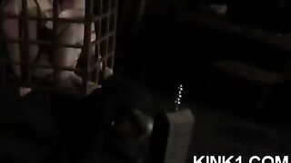 The slave is locked in a cage and forced to obey all orders