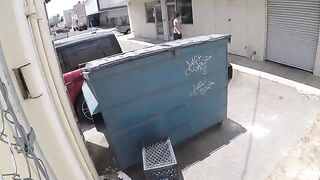 The couple got close behind the garbage tank and was photographed