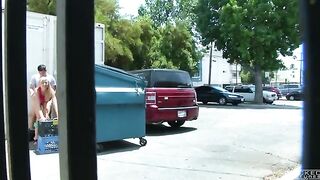 The couple got close behind the garbage tank and was photographed