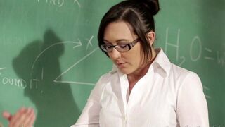 A girl is being fucked by her lesbian teacher right on the table