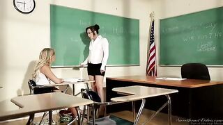 A girl is being fucked by her lesbian teacher right on the table