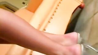Beautiful woman masturbating on a leather chair with her nice ass