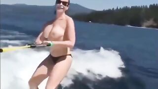 Topless beauty riding on the water skiing is very exciting, you should see it!
