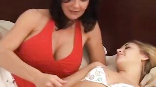 Hot lesbians having fun with a strapon, enjoying every moment of it