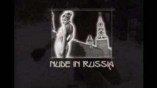 Nude girls are having fun with the snowball in the street