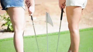 A beautiful woman is playing golf with her lesbian friend