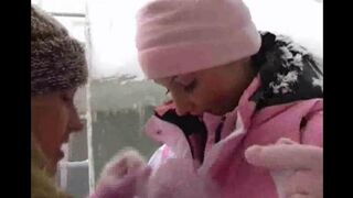 Two girls are having fun on a cold winter day, bringing some heat to the season