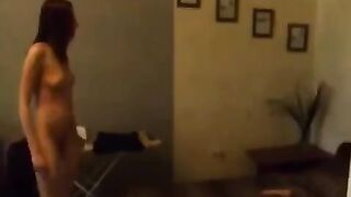 A cute Russian girl caresses herself in the kitchen