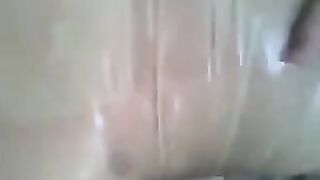 A guy put a condom on his dick and masturbated, fucking his hand