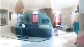 A fat black woman is having fun on the couch