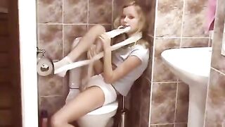 A hot blonde has sex in the public toilet, showcasing her natural charm
