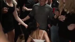 A mature woman is being fucked by several young men at once