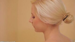 Hot girl masturbates with a toothbrush using a handle in the bathroom