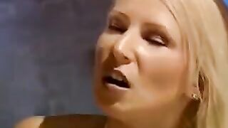 Beautiful woman in bondage, fucked by two guys with a machine
