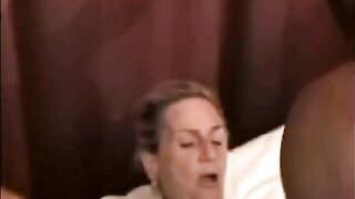 A mature woman is getting fucked by a black guy