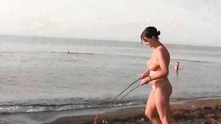 Nudist play on a sunny beach day