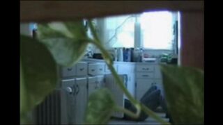 A married couple has fun without any clothes in their apartment