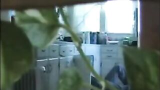 A married couple has fun without any clothes in their apartment