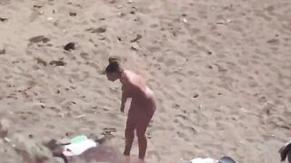 A hot pair of naked people in the middle of the sea