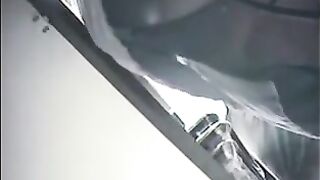 The employee put a camera under the skirt of the cashier