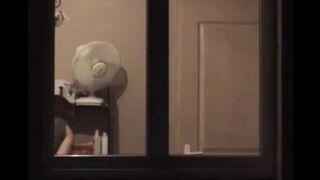 He admires himself in the mirror, completely naked in front of it