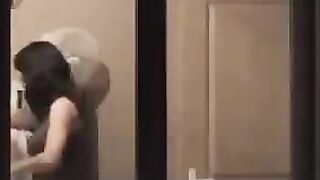 He admires himself in the mirror, completely naked in front of it