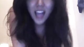 Hot Asian girl masturbating on the bed with intense pleasure