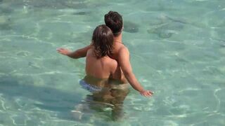 Girl fingers a guy underwater in the pool on holiday