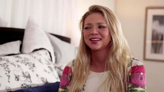 Two beautiful girls are stuck in bed and have fun