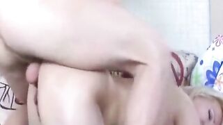 A mature woman with dark hair has anal sex right at home