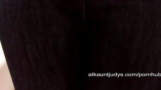 An old woman caresses her pussy while masturbating on the couch