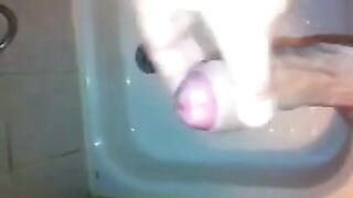 The kid caresses his dick in the shower and masturbates to the end